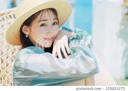 Young woman enjoying vacation at resort 128823275