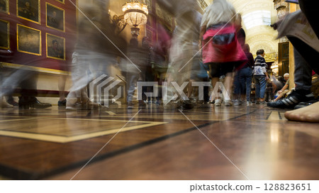 People visiting the sights in the museum. Bottom view. People visiting the sights in the museum. Bottom view. 128823651