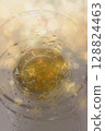 Abstract Turkish Tea Reflection with Golden Bokeh 128824463