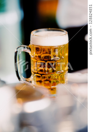 Ice cold beer in a glass. Summer evening 128824851
