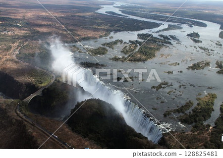 Victoria Falls and the Zambezi River, one of the world's three largest waterfalls, seen from a scenic flight Victoria Falls and the Zambezi River, one of the world's three largest waterfalls, seen from a scenic flight 128825481