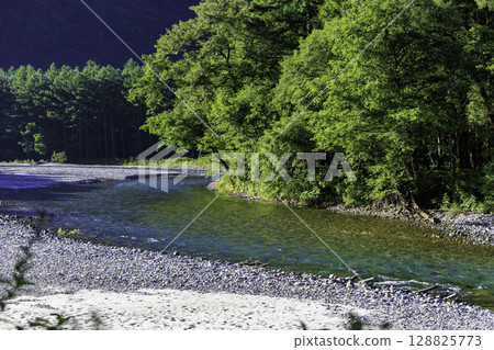 A clear, transparent stream and the beautiful blue color of the Azusa River in summer A clear, transparent stream and the beautiful blue color of the Azusa River in summer 128825773