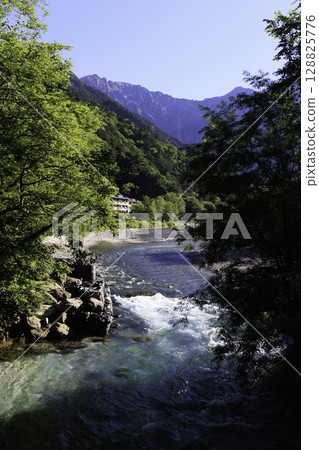 A clear, transparent stream and the beautiful blue color of the Azusa River in summer A clear, transparent stream and the beautiful blue color of the Azusa River in summer 128825776