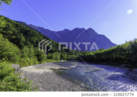 A clear, transparent stream and the beautiful blue color of the Azusa River in summer A clear, transparent stream and the beautiful blue color of the Azusa River in summer 128825779