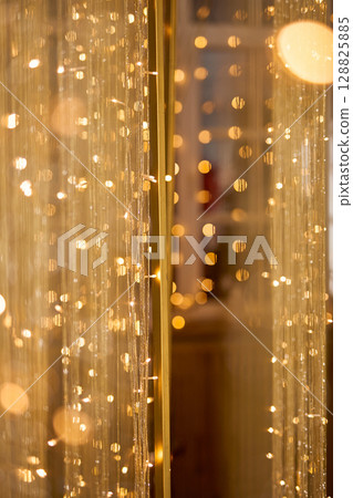 Golden Bokeh Background with Shimmering Threads 128825885