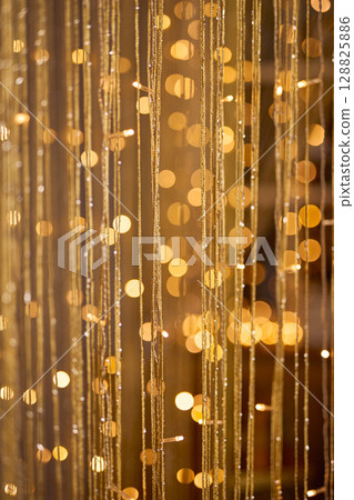 Golden Bokeh Background with Shimmering Threads 128825886