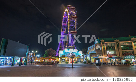 Wiener Riesenrad in Prater night timelapse hyperlapse - oldest and biggest ferris wheel in Austria. 128825993