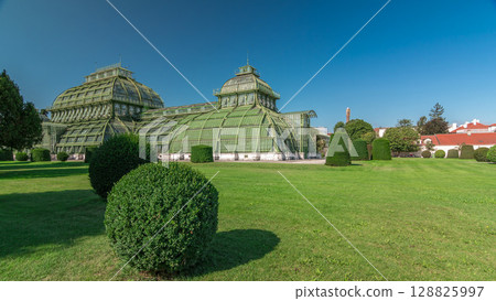 The Palmenhaus Schoenbrunn timelapse hyperlapse - a large greenhouse in the park Schoenbrunn in Vienna, Austria The Palmenhaus Schoenbrunn timelapse hyperlapse - a large greenhouse in the park Schoenbrunn in Vienna, Austria 128825997