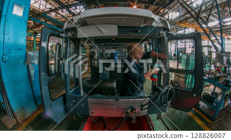 Conveyor assembly stage the body of tractor at big industrial factory timelapse 128826007