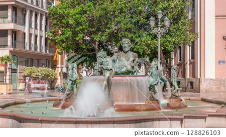Timelapse of Plaza de la Virgen with the iconic Turia Fountain in Valencia, Spain. Timelapse of Plaza de la Virgen with the iconic Turia Fountain in Valencia, Spain. 128826103