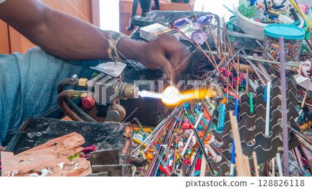 Glass blower working on crafts market timelapse, manufacture and workshop of Venetian glass 128826118
