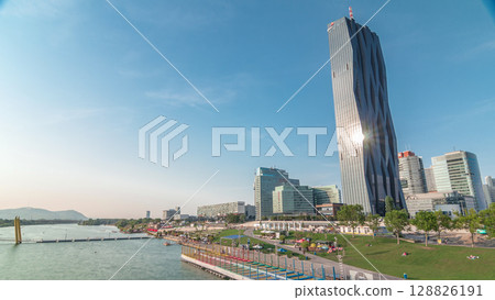 Donaustadt Danube City timelapse hyperlapse is a modern quarter with skyscrapers and business centres in Vienna, Austria. 128826191