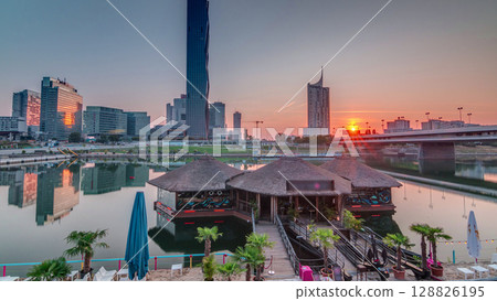 Sunrise over Donaustadt Danube City timelapse is a modern quarter with skyscrapers and business centres in Vienna, Austria. Sunrise over Donaustadt Danube City timelapse is a modern quarter with skyscrapers and business centres in Vienna, Austria. 128826195