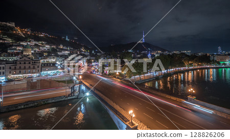 Colorful traditional houses panorama with wooden carved balconies in the Old Town of Tbilisi aerial timelapse, Georgia. 128826206