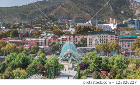 Timelapse of the Bridge of Peace, a bow-shaped pedestrian bridge in Tbilisi, Georgia 128826227