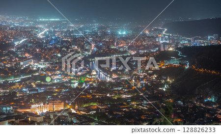 Aerial night timelapse of Rike Park, a modern urban park in Tbilisi's Old Town. Georgia 128826233