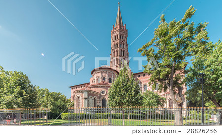 The cobbled parvis of the Basilica of Saint Sernin in Toulouse, France, timelapse hyperlapse. 128826236