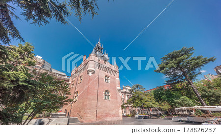 Renaissance dungeon clock tower and classical brick facade of the Capitole timelapse hyperlapse, city hall of Toulouse, France 128826237