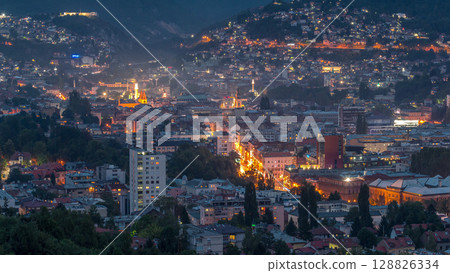 Aerial view of the historic part of Sarajevo city day to night timelapse. 128826334