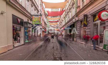 Walk on Ferhadija pedestrian street crowded with people timelapse hyperlapse Walk on Ferhadija pedestrian street crowded with people timelapse hyperlapse 128826338