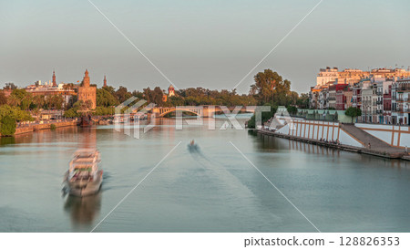 Aerial view of Seville divided by the river Guadalquivir timelapse hyperlapse 128826353