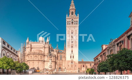 Seville Cathedral and Giralda Tower timelapse hyperlapse panorama, Spain 128826375