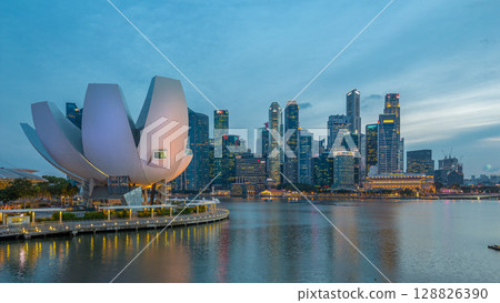 Art Science museum day to night timelapse and skyscrapers skyline city of Singapore. 128826390