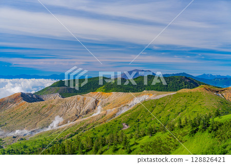(Gunma Prefecture) View from Shibu Pass (the highest point on the national highway in Japan), with the crater of Mt. Shirane and Mt. Asama in the background 128826421