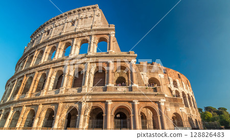 The Colosseum or Coliseum timelapse hyperlapse, also known as the Flavian Amphitheatre in Rome, Italy The Colosseum or Coliseum timelapse hyperlapse, also known as the Flavian Amphitheatre in Rome, Italy 128826483