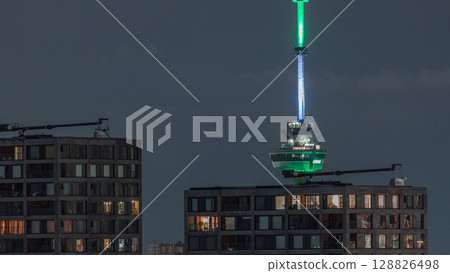 Rotterdam night cityscape timelapse with Euromast observation tower and glowing windows in high-rise buildings Rotterdam night cityscape timelapse with Euromast observation tower and glowing windows in high-rise buildings 128826498