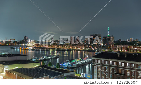 Aerial panoramic view over Maashaven night timelapse in Rotterdam. 128826504