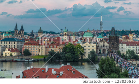 Scenic summer aerial view of the Old Town pier architecture and Charles Bridge over Vltava river timelapse in Praha. Prague, Czech Republic. 128826616
