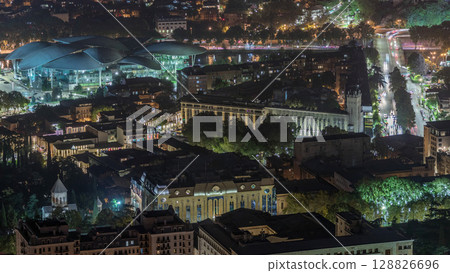 Public Service Hall seen from viewpoint in Tbilisi city illuminated at night timelapse. Georgia 128826696