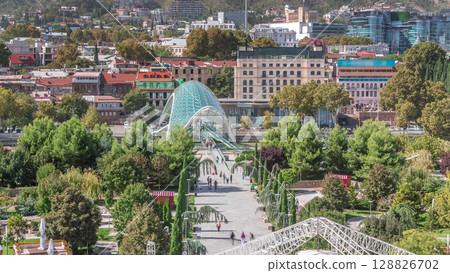 Timelapse of the Bridge of Peace, a bow-shaped pedestrian bridge in Tbilisi, Georgia Timelapse of the Bridge of Peace, a bow-shaped pedestrian bridge in Tbilisi, Georgia 128826702