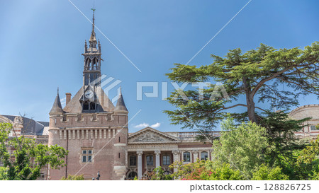 Renaissance dungeon clock tower and classical brick facade of the Capitole timelapse hyperlapse, city hall of Toulouse, France 128826725