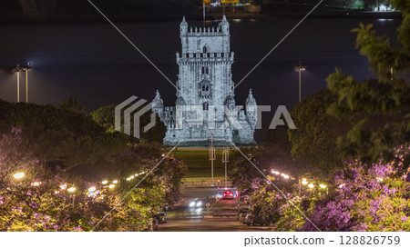 View of Avenida Torre de Belem night timelapse, with cars and the Belem Tower in the background. Lisbon, Portugal 128826759