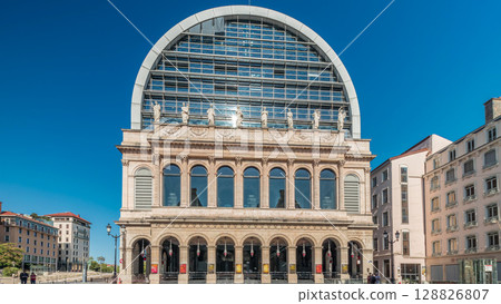 Hyperlapse of Lyon's opera house featuring neoclassical architecture combined with a modern glass dome roof. France 128826807