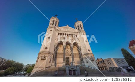 Hyperlapse front view of the Basilica of Notre Dame de Fourviere during sunset in Lyon, France. Hyperlapse front view of the Basilica of Notre Dame de Fourviere during sunset in Lyon, France. 128826812