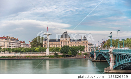 Panoramic hyperlapse view of the Rhone River and its embankment, featuring the University Jean-Moulin in Lyon, France. 128826829