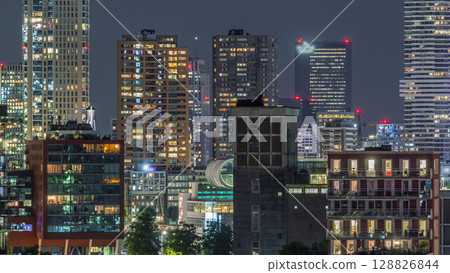 Aerial timelapse of modern buildings in Rotterdam city center, The Netherlands. Aerial timelapse of modern buildings in Rotterdam city center, The Netherlands. 128826844