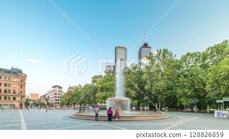Opera Square timelapse hyperlapse in downtown Frankfurt, Germany, showcases a fountain with skyscrapers Opera Square timelapse hyperlapse in downtown Frankfurt, Germany, showcases a fountain with skyscrapers 128826859