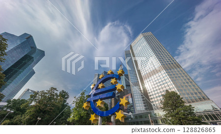 Timelapse hyperlapse of the Euro currency sign in downtown Frankfurt near the former headquarters of the European Central Bank. Germany Timelapse hyperlapse of the Euro currency sign in downtown Frankfurt near the former headquarters of the European Central Bank. Germany 128826865