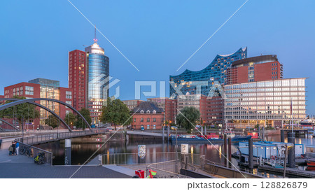 Jan Fedder Promenade day to night timelapse hyperlapse in Hamburg, Germany, a vibrant waterfront area. 128826879
