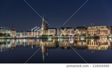 Night timelapse of Binnenalster in Hamburg, Germany, with City Hall and Nikolai Church. 128826880