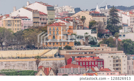 Aerial view over the center of Lisbon to the viewpoint called Miradouro de Sao Pedro de Alcantara timelapse. 128826913