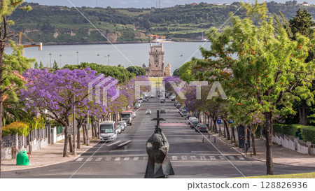 View of Avenida Torre de Belem timelapse, with cars and the Belem Tower in the background. Lisbon, Portugal 128826936