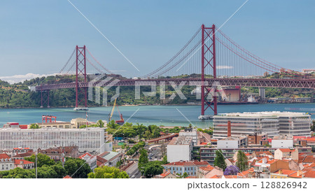 The 25th April Bridge aerial timelapse, Ponte 25 de Abril in Portuguese, longest suspension bridge in Europe. Lisbon, Portugal 128826942