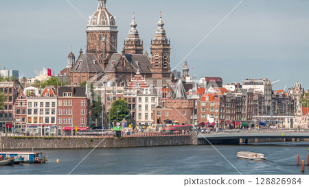 Aerial cityscape with the Basilica of Saint Nicholas in Amsterdam's Old Centre near the Central Station timelapse. Aerial cityscape with the Basilica of Saint Nicholas in Amsterdam's Old Centre near the Central Station timelapse. 128826984