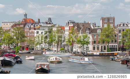 Timelapse of a busy river in Amsterdam's city center on a sunny day. Amsterdam, Netherlands Timelapse of a busy river in Amsterdam's city center on a sunny day. Amsterdam, Netherlands 128826985