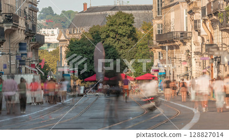 L'Intendance Street in Bordeaux timelapse during sunset with modern trams 128827014